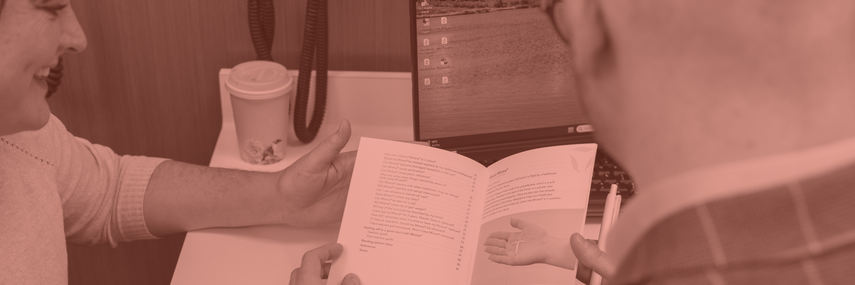 Dr Sam Holford showing a Mirena patient information booklet