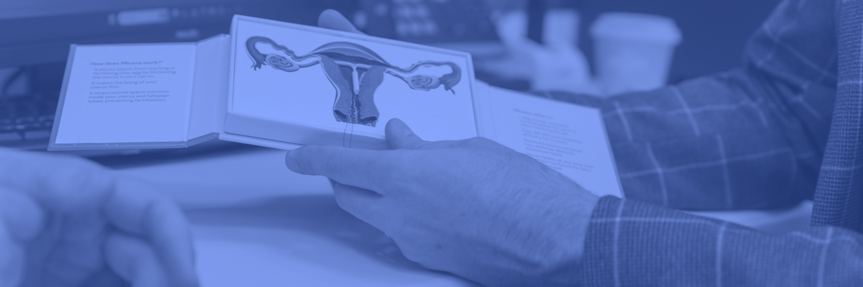 Dr Sam Holford demonstrating the Mirena IUS with a model