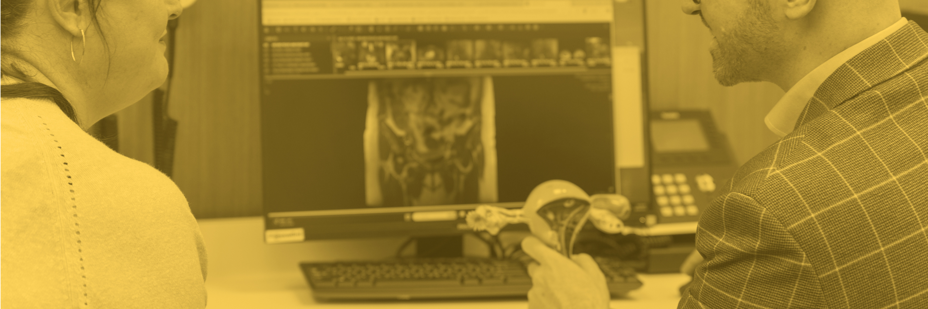 Dr Sam Holford showing an MRI scan